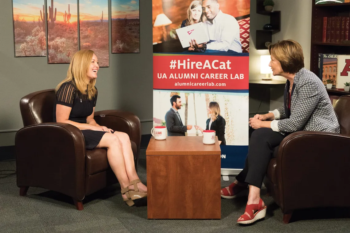 A photograph of Suzanne Rausche being interviewed by Melinda Burke 