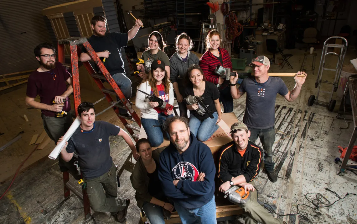 A photograph of Ted Kraus center, with an automation design class around him