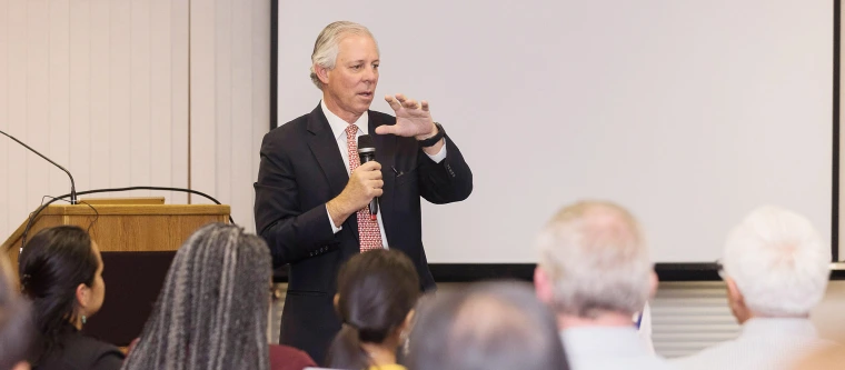 President Robbins speaking to group