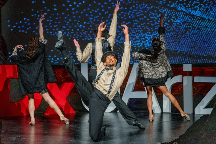 A photograph of School of Dance students Riley Jo Parish, Kennedy Frazier, Kyle Anders and Diego Gonzales perform to the music of big band legend Count Basie onstage at Centennial Hall.