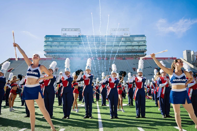 A photo of the Pride of Arizona performing in Arizona stadium.