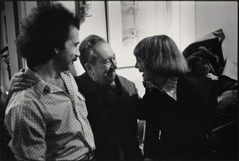 A black and white photograph of BD Vidibor, Aaron Siskind and Diana Edkins chatting and laughing