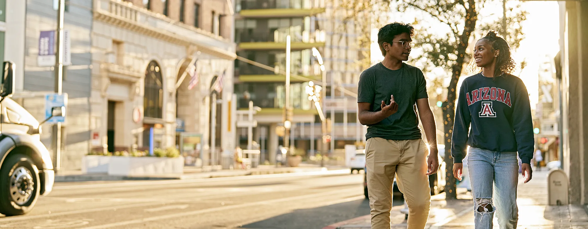 Two students walking downtown