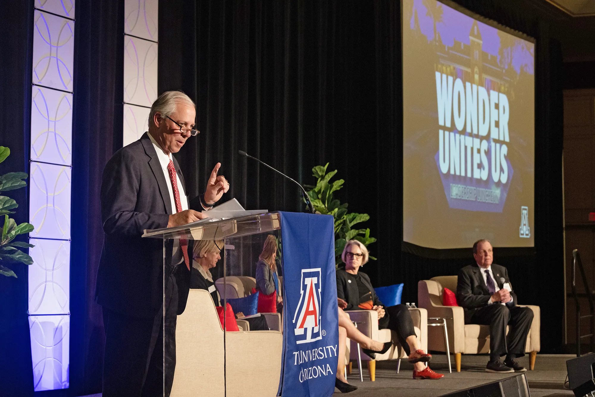 President Robbins speaking at podium