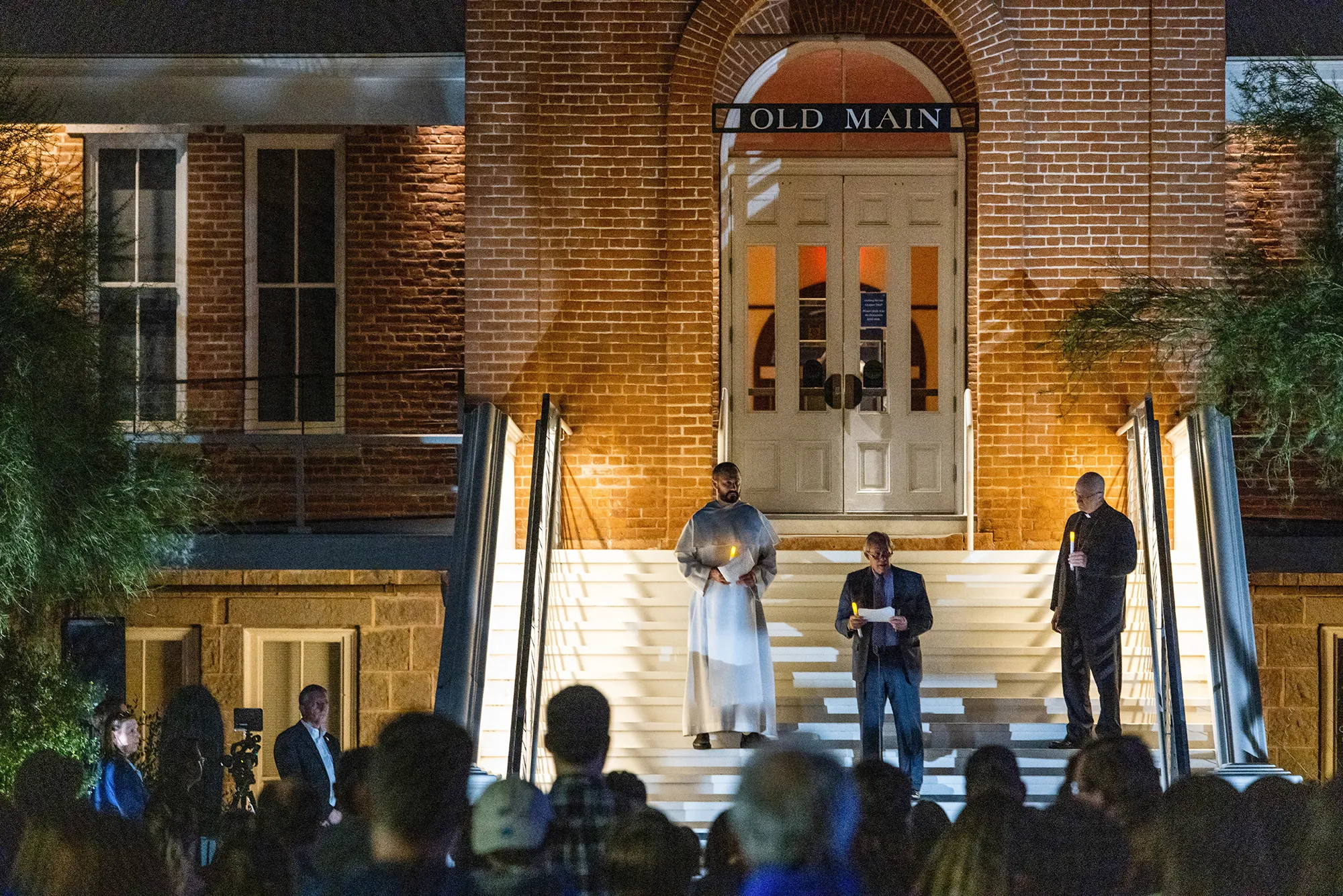 A candlelight vigil on the steps of Old Main