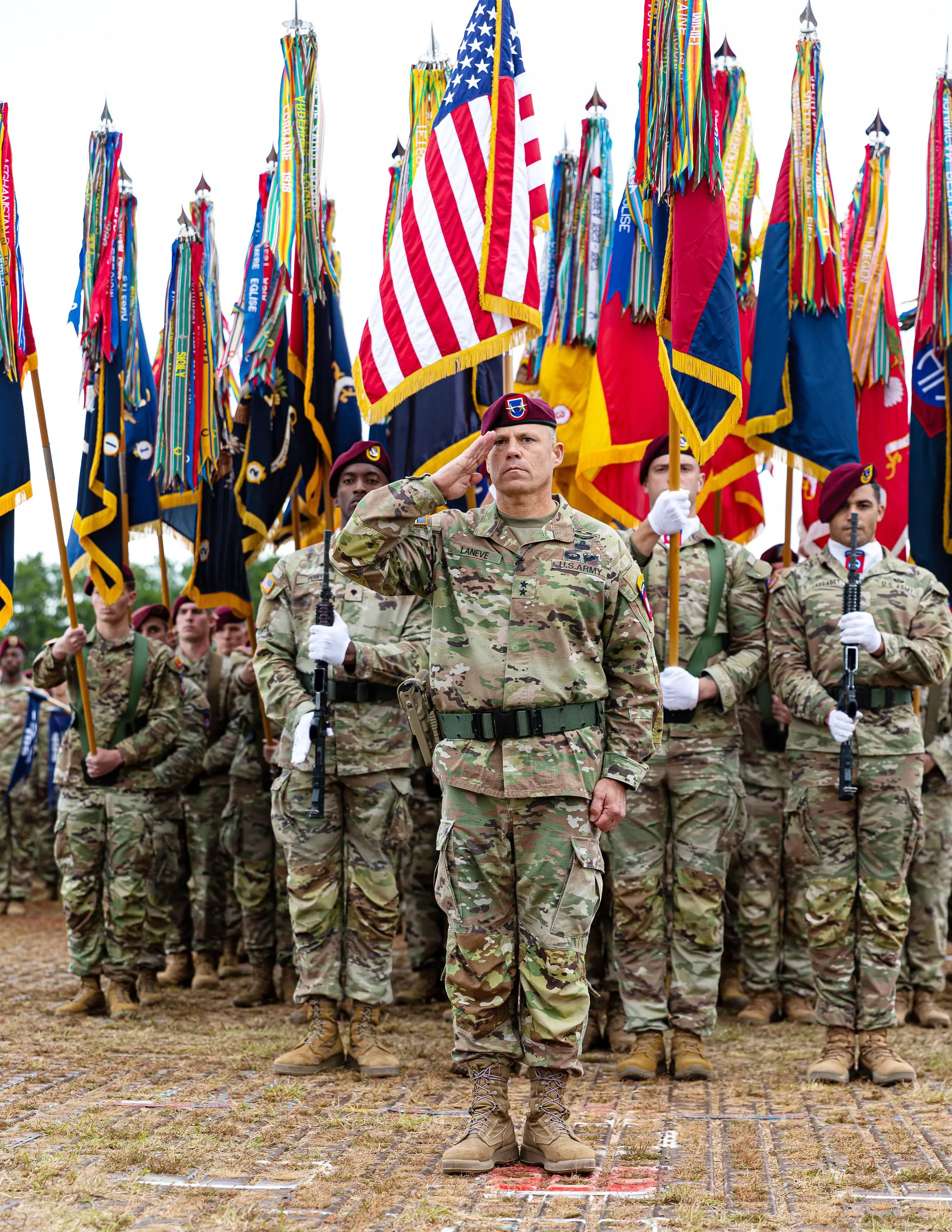 Photo of Army Major General Chris Laneve '89 saluting.