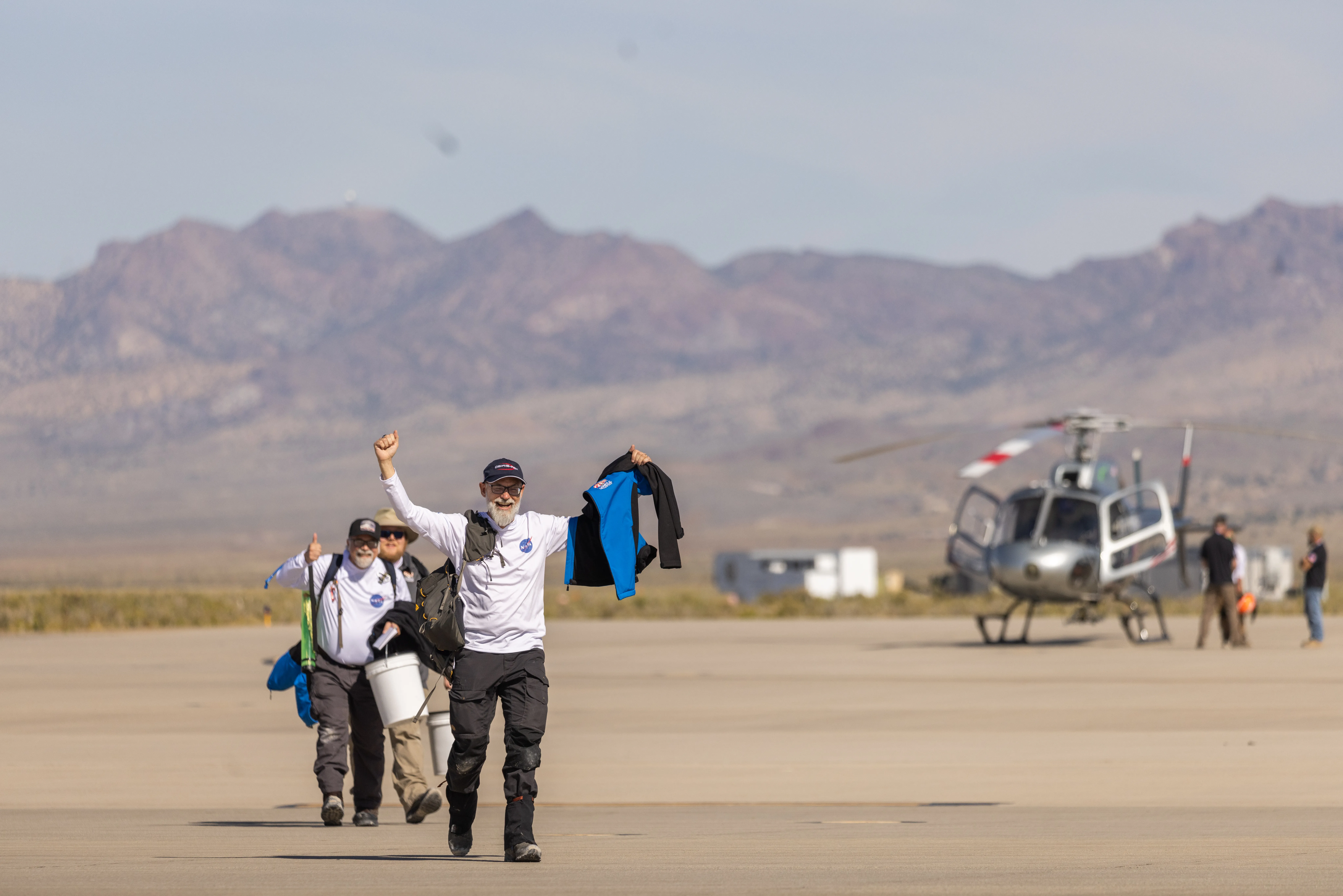 Dante Lauretta, principal investigator for NASA’s Wildcat-led OSIRIS-REx mission, celebrates in the Utah desert after the historic Sept. 24 return of a sample of the asteroid Bennu. Before the mission, the United States had never returned an asteroid sample to Earth. Lauretta serves as a Regents Professor of planetary science and cosmochemistry at the University of Arizona. 