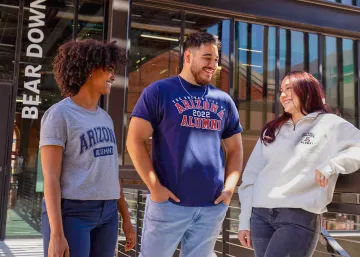 Group of people talking, wearing Wildcat gear