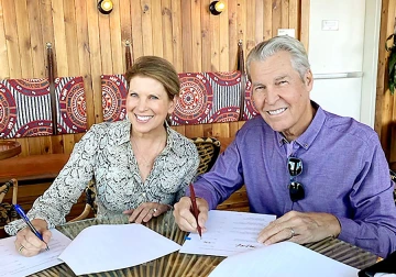 Man and woman signing papers