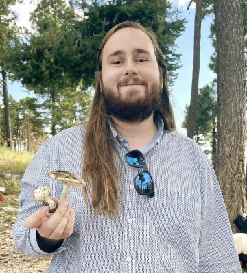 Man holding mushrooms