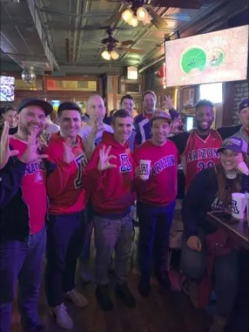 Group in Wildcat gear in a sports bar