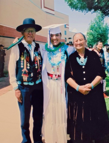 Richelle Thomas with her grandparents at her graduation ceremony