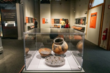 A photograph of three artifacts on opening day 