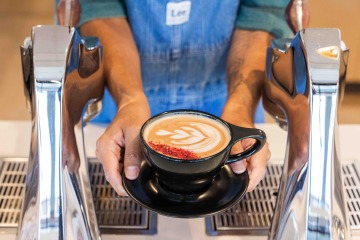 Barista shows off latte art