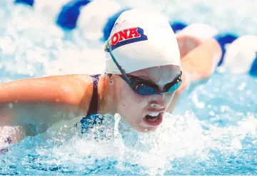 Swimmer races through water