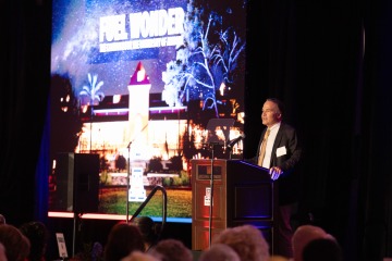 Image of Dean Fredric Wondisford speaking at a podium
