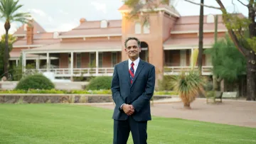 Image of Suresh Garimella standing in front of Old Main.