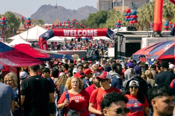 A crowd of people wearing Wildcat gear during Homecoming