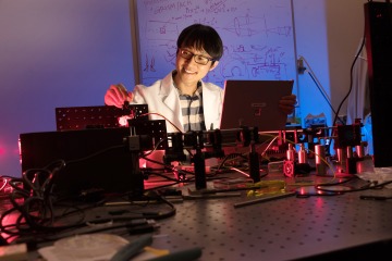 A photograph of Dongkyun Kang working in a lab