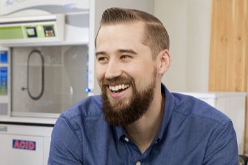 A photograph of Sean McClain smiling